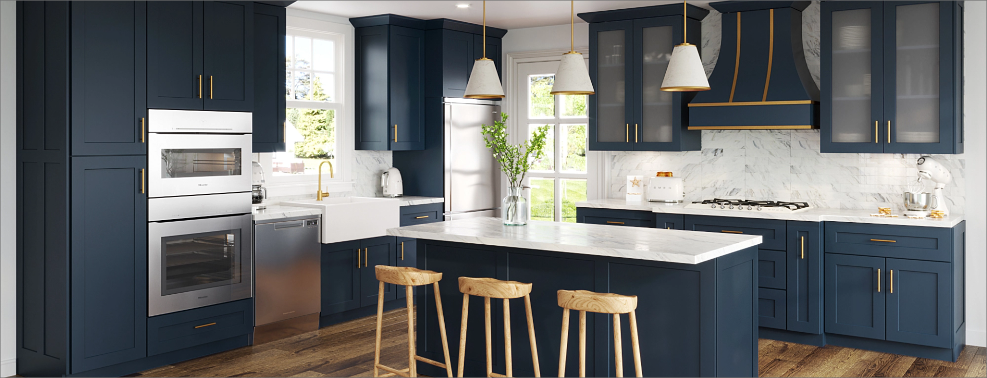 Blue painted kitchen cabinetry with brass hardware